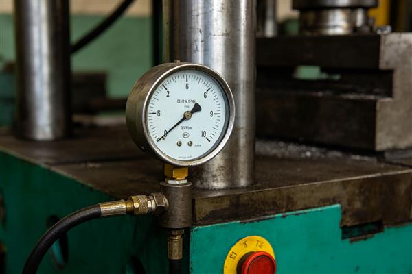 How do I calculate the required press tonnage for a stamping die?